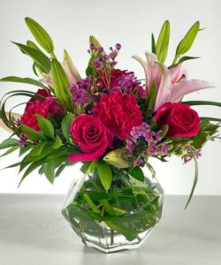Lilies, Roses, and Carnations in a sweet bubble bowl gives you pink perfection!