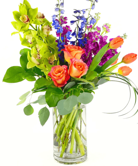 Beautiful orchids, roses, and delphinium make you dream of a tropical place on a relaxing beach!