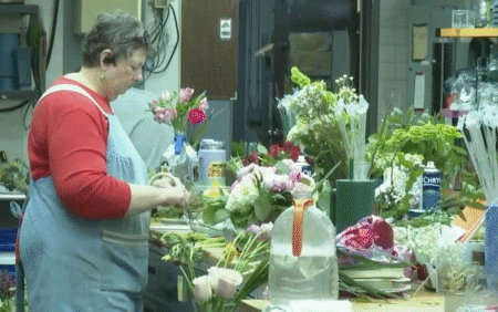 A florist working on flowers in a shop